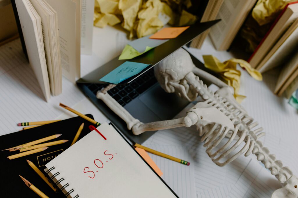 Skeleton on computer desk.