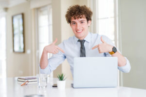 Teenage intern sitting at an oversized corporate desk, somehow radiating “accidental senior executive” energy.